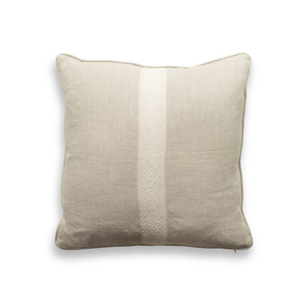 Product shot of the front of a decorative cushion which features a neutral woven fabric and a contrasting trim down the middle.